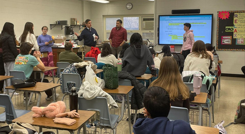 Students watching a presentation.
