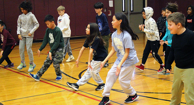Students dancing in the gym.