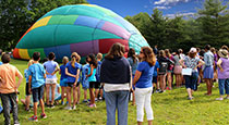 Central School students and staff gather around the hot air balloon as it becomes inflated.