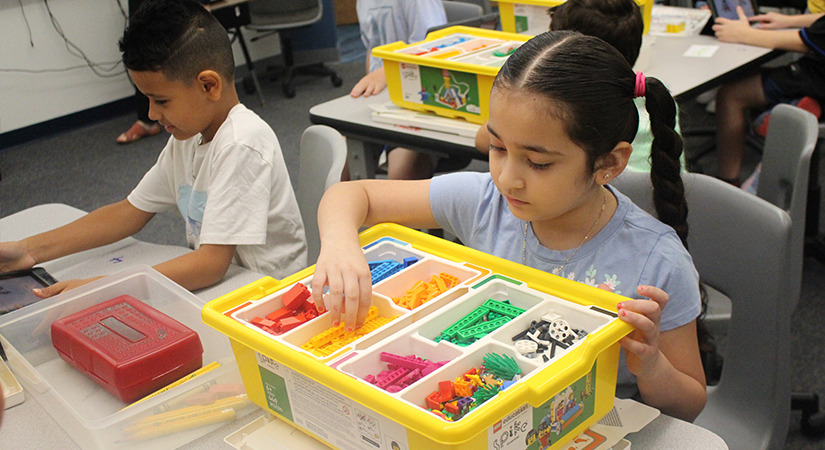 Students working with legos