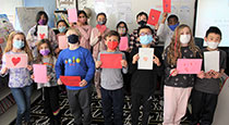 Students holding valentines