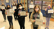 Students holding awards