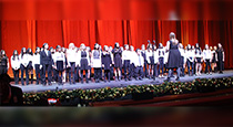 Students singing at Radio Center Music Hall