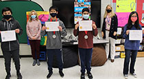 Students holding certificates