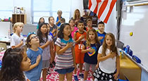 Students saluting the flag.