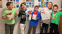 Students holding gifts.