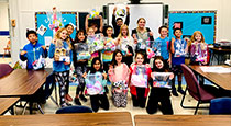 Students holding first-night kits