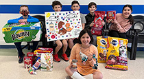 Students holding donations.