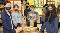 Students with sandwich bags.