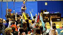 Students watching a science assembly.