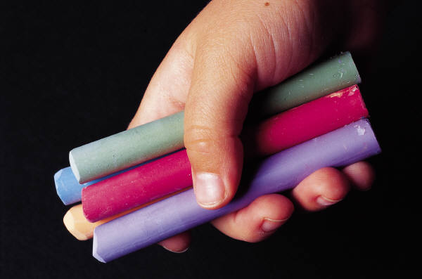 A person holding chalk